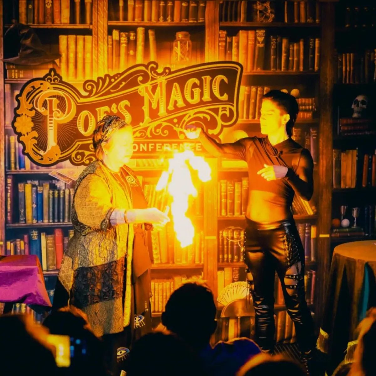 Tara McAllister presenting a dramatic fire illusion at Poe's Magic Conference