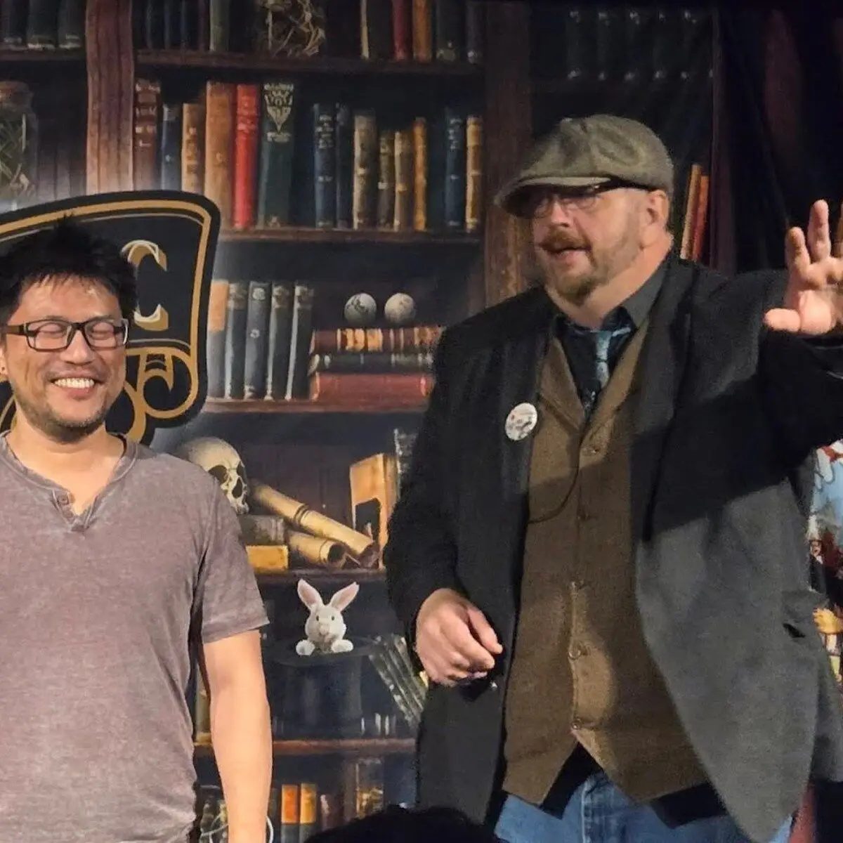 Two magicians sharing an informal moment during Poe's Magic Conference
